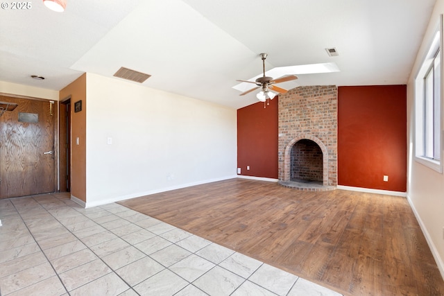 400 S 28th Ave, Cornelius, OR 97113 - unfurnished living room with a ceiling fan, lofted ceiling, wood finished floors, a brick fireplace, and baseboards