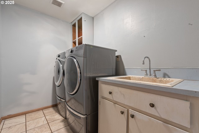 400 S 28th Ave, Cornelius, OR 97113 - washroom featuring washing machine and dryer, cabinet space, baseboards, and light tile patterned floors