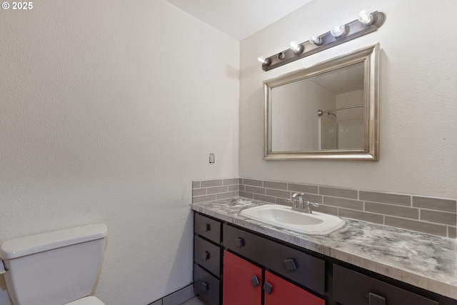 400 S 28th Ave, Cornelius, OR 97113 - bathroom featuring vanity, toilet, and decorative backsplash