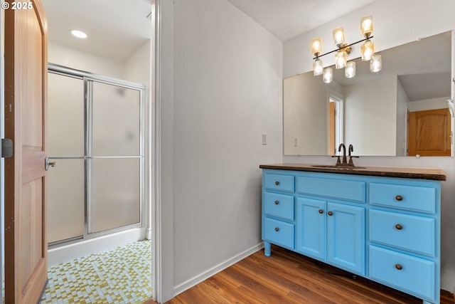 400 S 28th Ave, Cornelius, OR 97113 - full bath with vanity, a shower stall, baseboards, and wood finished floors