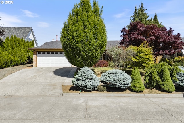 400 S 28th Ave, Cornelius, OR 97113 - obstructed view of property featuring concrete driveway and an attached garage