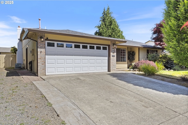 400 S 28th Ave, Cornelius, OR 97113 - ranch-style house featuring a garage, driveway, a chimney, and brick siding