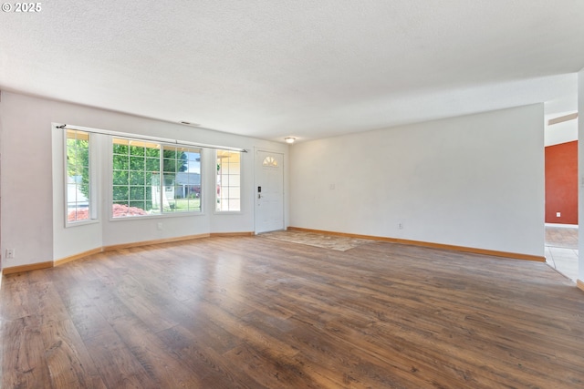 400 S 28th Ave, Cornelius, OR 97113 - empty room with wood finished floors, baseboards, and a textured ceiling