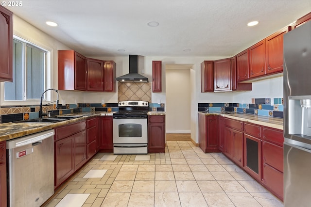 400 S 28th Ave, Cornelius, OR 97113 - kitchen with wall chimney range hood, appliances with stainless steel finishes, reddish brown cabinets, a sink, and decorative backsplash