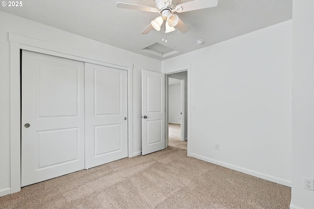unfurnished bedroom featuring carpet floors, baseboards, and a closet