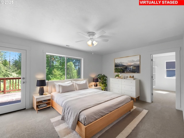 bedroom featuring access to outside, ceiling fan, visible vents, and light carpet