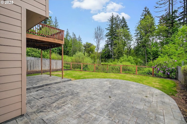 view of patio featuring a fenced backyard and a deck