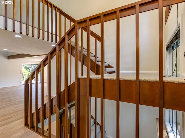 7785 SW W Slope Dr, Portland, OR 97225 - stairs featuring wood finished floors and recessed lighting