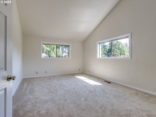 7785 SW W Slope Dr, Portland, OR 97225 - spare room featuring vaulted ceiling, plenty of natural light, and carpet