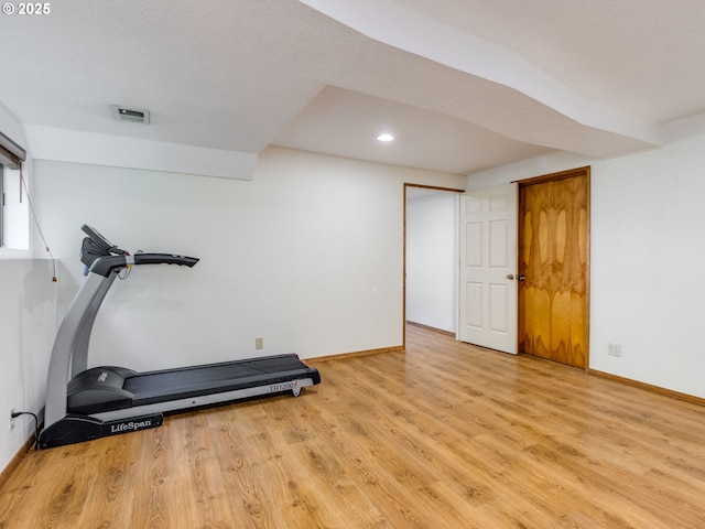 7785 SW W Slope Dr, Portland, OR 97225 - exercise room with light wood finished floors and recessed lighting