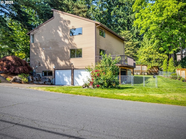 7785 SW W Slope Dr, Portland, OR 97225 - view of home's exterior with an attached garage and a wooden deck