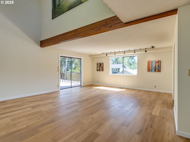 7785 SW W Slope Dr, Portland, OR 97225 - empty room with rail lighting and light wood-style floors