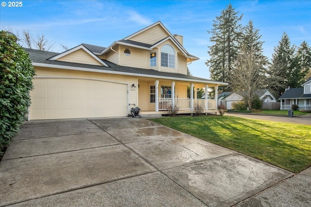 view of front of property featuring a front lawn, a porch, and a garage