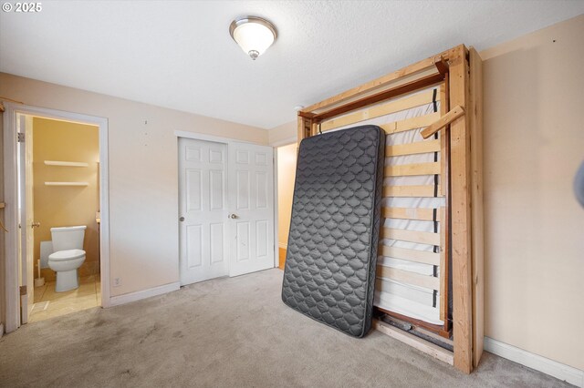 7080 SW Taylors Ferry Rd, Portland, OR 97223 - unfurnished bedroom with carpet floors, ensuite bath, a closet, and baseboards