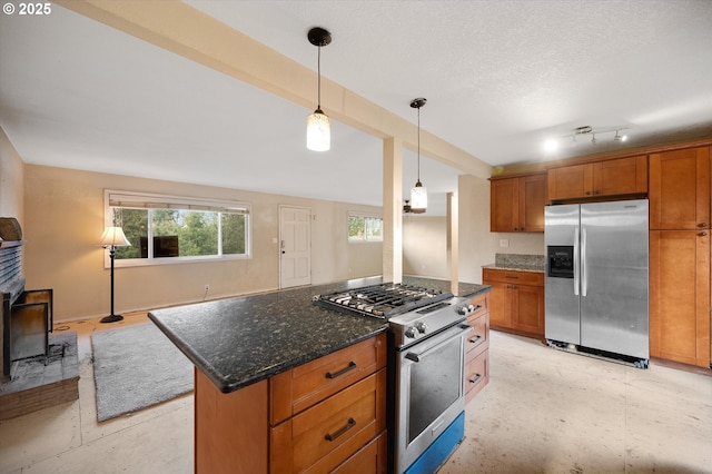 7080 SW Taylors Ferry Rd, Portland, OR 97223 - kitchen featuring stainless steel appliances, brown cabinets, open floor plan, and decorative light fixtures