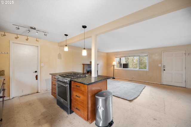 7080 SW Taylors Ferry Rd, Portland, OR 97223 - kitchen with gas range, a fireplace, brown cabinetry, open floor plan, and pendant lighting