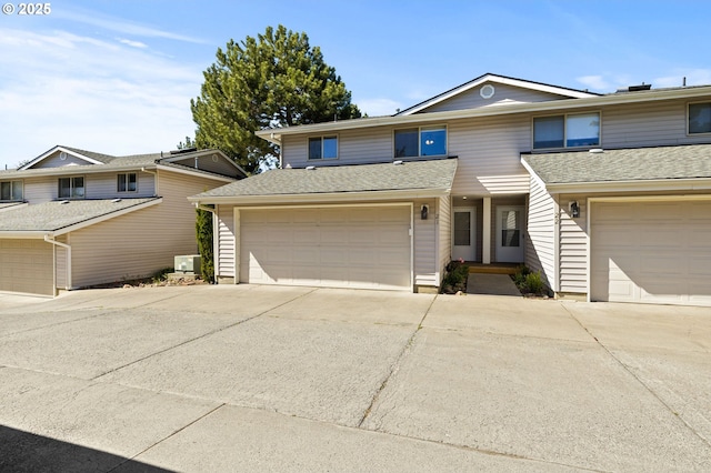 1801 NE Purcell Blvd Unit 21, Bend, OR 97701 - townhome / multi-family property with a garage, driveway, and roof with shingles