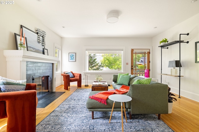 2904 NE 51st Ave, Portland, OR 97213 - living room with wood finished floors, a tile fireplace, and baseboards