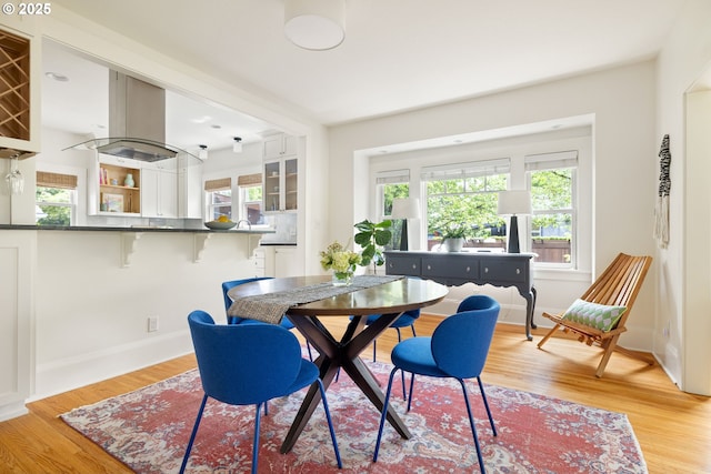 2904 NE 51st Ave, Portland, OR 97213 - dining space with light wood-type flooring, healthy amount of natural light, and baseboards