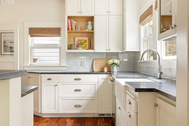2904 NE 51st Ave, Portland, OR 97213 - kitchen with tasteful backsplash, white cabinetry, and dark countertops