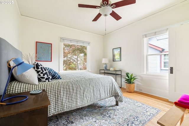2904 NE 51st Ave, Portland, OR 97213 - bedroom featuring wood finished floors, baseboards, and ceiling fan