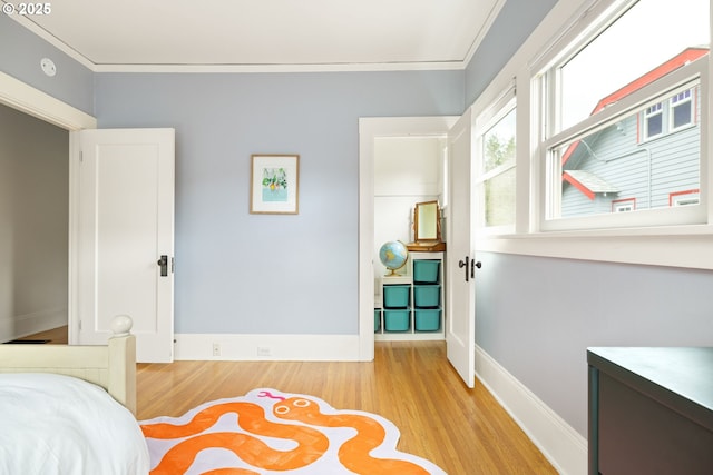 2904 NE 51st Ave, Portland, OR 97213 - bedroom with light wood-style floors, ornamental molding, and baseboards