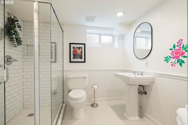 2904 NE 51st Ave, Portland, OR 97213 - bathroom with toilet, wainscoting, a shower stall, and a sink