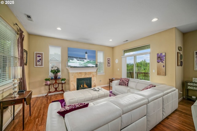 2356 Benjamin Ave, Salem, OR 97304 - living room featuring healthy amount of natural light, wood finished floors, baseboards, a tile fireplace, and recessed lighting