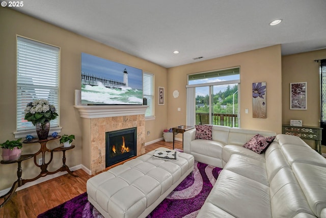 2356 Benjamin Ave, Salem, OR 97304 - living area with wood finished floors, baseboards, a tiled fireplace, and recessed lighting