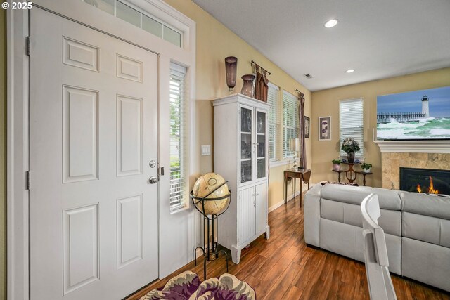 2356 Benjamin Ave, Salem, OR 97304 - foyer entrance with wood finished floors, plenty of natural light, recessed lighting, baseboards, and a glass covered fireplace