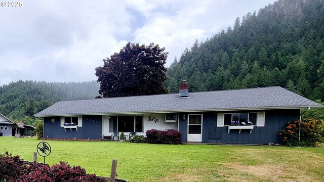 2965 S Myrtle Rd, Myrtle Creek, OR 97457 - ranch-style home featuring a wooded view, a chimney, and a front yard