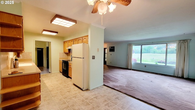 2965 S Myrtle Rd, Myrtle Creek, OR 97457 - kitchen featuring freestanding refrigerator, open shelves, a ceiling fan, light colored carpet, and black range with electric stovetop