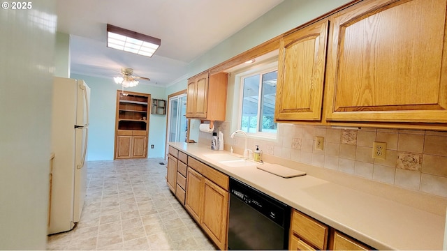 2965 S Myrtle Rd, Myrtle Creek, OR 97457 - kitchen featuring dishwasher, a sink, freestanding refrigerator, tasteful backsplash, and light countertops