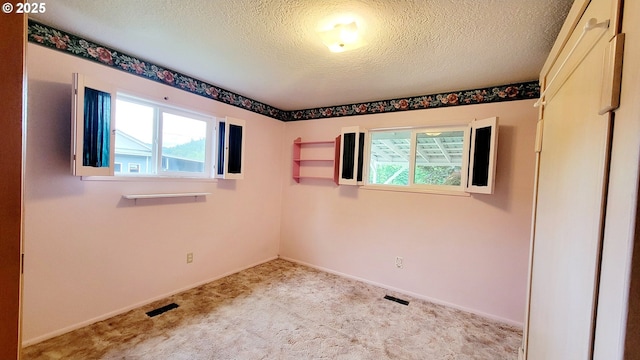 2965 S Myrtle Rd, Myrtle Creek, OR 97457 - carpeted empty room with a textured ceiling and baseboards
