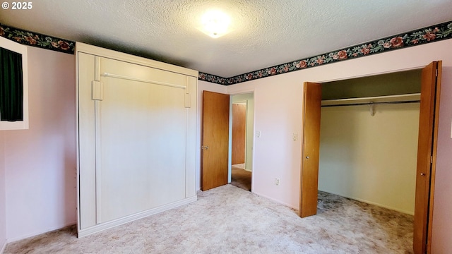 2965 S Myrtle Rd, Myrtle Creek, OR 97457 - unfurnished bedroom featuring carpet floors, a closet, and a textured ceiling