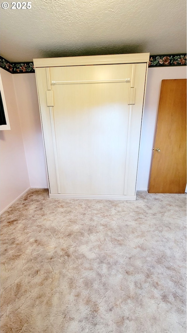 2965 S Myrtle Rd, Myrtle Creek, OR 97457 - unfurnished bedroom featuring a textured ceiling and carpet flooring