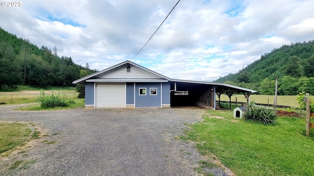 2965 S Myrtle Rd, Myrtle Creek, OR 97457 - garage with a garage, a view of trees, and driveway