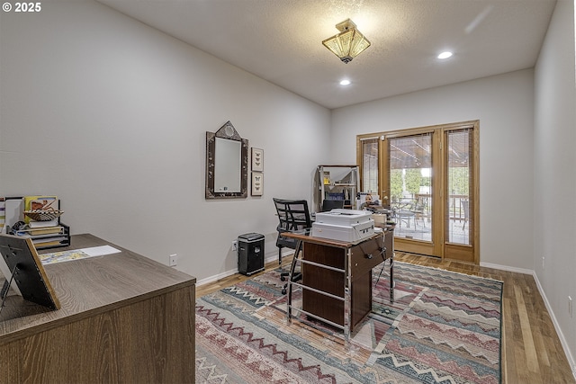 610 NE Sundance Ct, Hillsboro, OR 97124 - home office featuring wood finished floors, baseboards, and recessed lighting