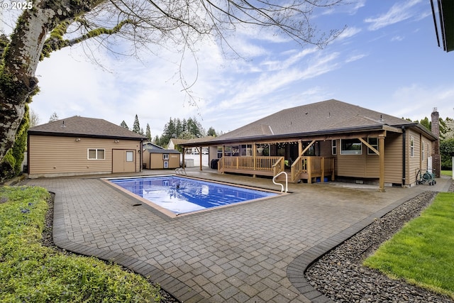 610 NE Sundance Ct, Hillsboro, OR 97124 - view of pool featuring a wooden deck and a patio