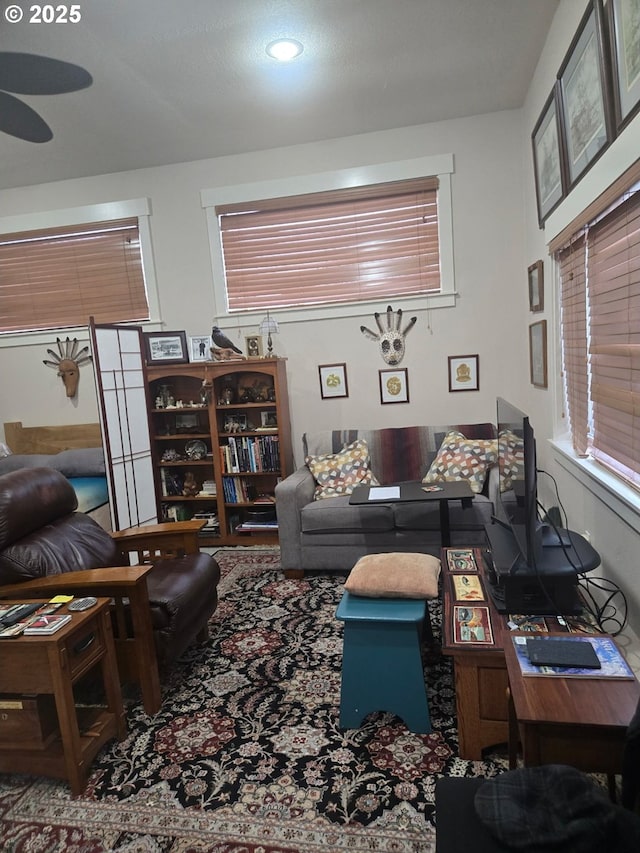 610 NE Sundance Ct, Hillsboro, OR 97124 - living area with ceiling fan and carpet floors
