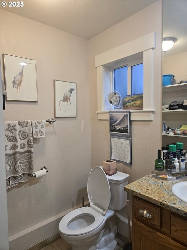 610 NE Sundance Ct, Hillsboro, OR 97124 - half bathroom featuring toilet, vanity, and baseboards