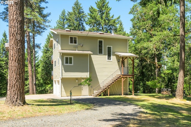 32475 Beymer Rd, Eugene, OR 97405 - view of front of home featuring gravel driveway, stairs, an attached garage, and a front yard