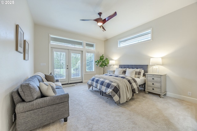 bedroom featuring light carpet, access to outside, multiple windows, and french doors