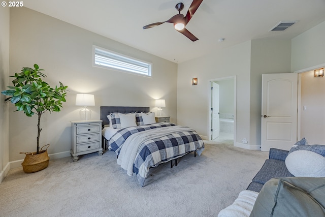 bedroom featuring light carpet, connected bathroom, visible vents, and baseboards