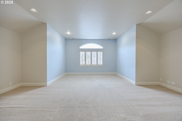 carpeted empty room with recessed lighting and baseboards