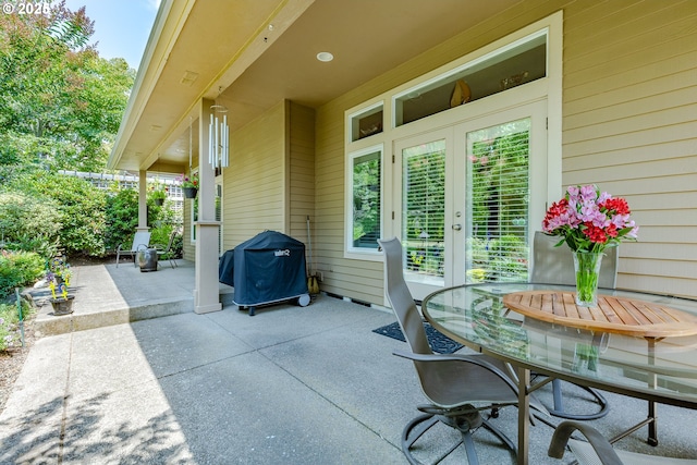 view of patio / terrace with a grill and french doors