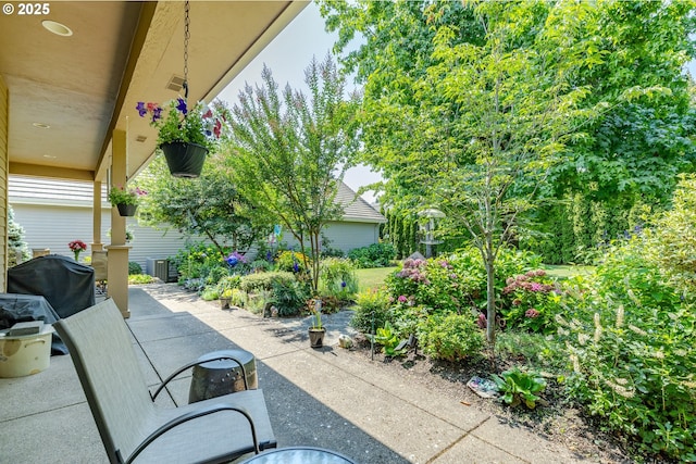 view of patio featuring visible vents and grilling area