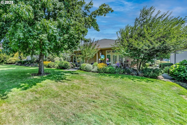 view of yard with french doors