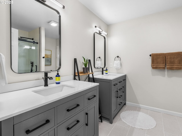 14428 Holly Springs Rd, Lake Oswego, OR 97035 - bathroom featuring two vanities, a stall shower, tile patterned flooring, and baseboards