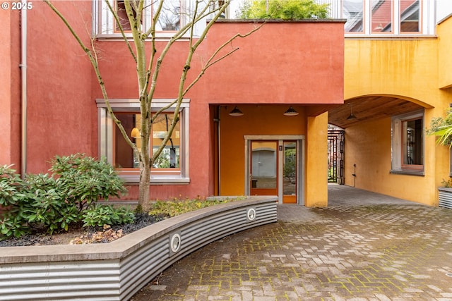 321 Mill St Unit 4, Eugene, OR 97401 - view of exterior entry featuring stucco siding